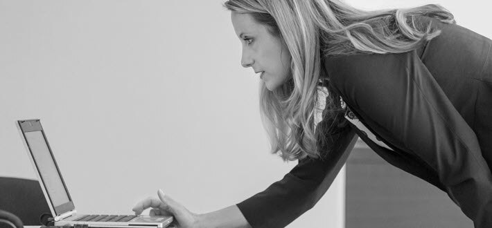 A compliance officer checks her email