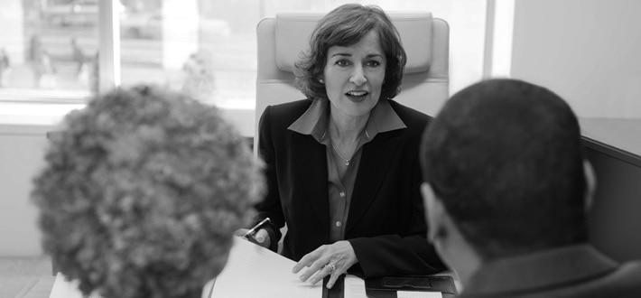 Financial advisor meeting with clients
