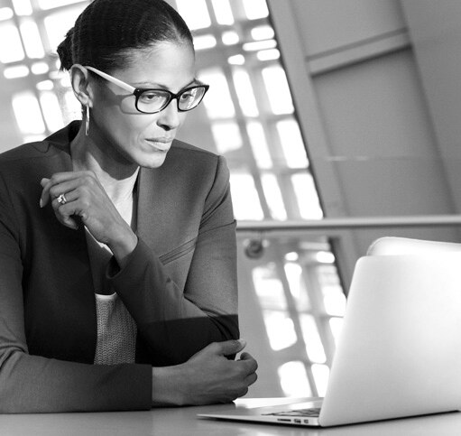 Woman looking at laptop