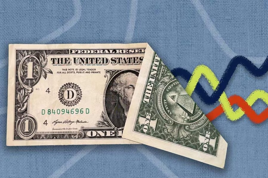 A dollar bill folded, with illustrated chart lines underneath it.