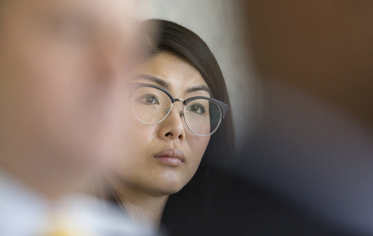 An investment advisor listens to tips for improving her firm’s online presence.