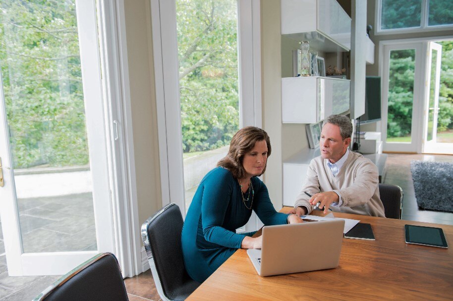 woman and man on laptop