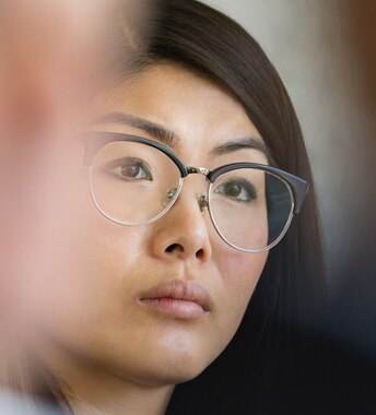 A female advisor listens to tips for improving her firm’s online presence.